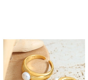 Detail of gold plated titanium steel necklaces with elegant freshwater pearls