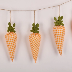Detail view of Easter carrot banner featuring orange plaid fabric and green felt leaves