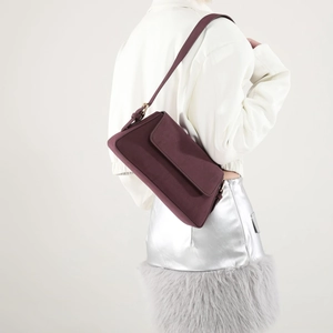 Retro burgundy matte faux suede underarm bag styled with a white leather jacket