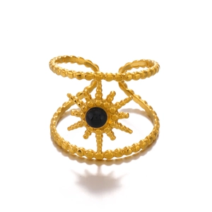French vintage sunburst gold plated ring with black natural stone inlay on white background