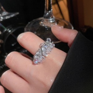Close-up of sparkling marquise-cut zircons set on a French-style silver geometric ring