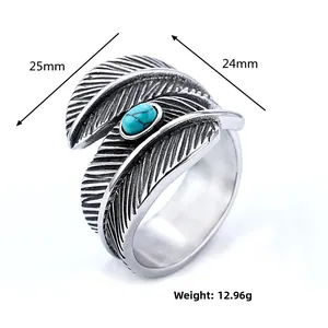 Detailed size view of vintage stainless steel feather ring with oval turquoise stone