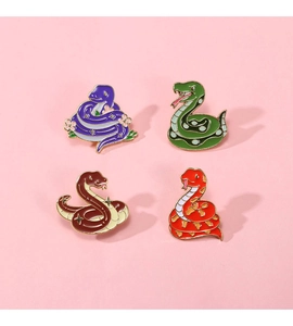 Set of four colorful cartoon snake enamel pins with gold metal borders and vibrant patterns