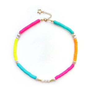 Bohemian colorful heishi clay bead necklace with pearls and gold star clasp on white background