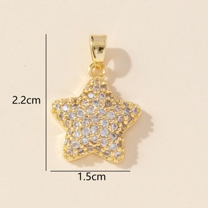 Detail of gold star pendant with micro-pave cubic zirconia and dimensions 2.2cm by 1.5cm