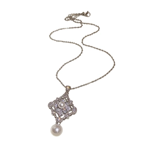 Silver pearl necklace with a vintage rhombic zircon pendant and teardrop pearl drop
