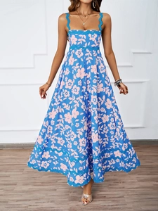 Close-up of pink floral print and blue scalloped trim on a summer maxi dress