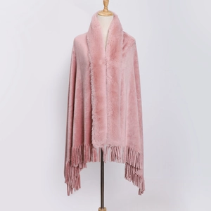 Pink flannel poncho with faux rabbit fur collar and fringe trim on white background