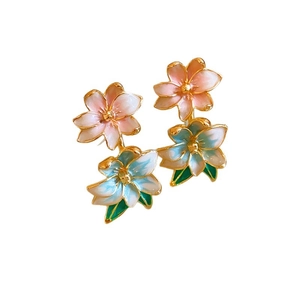 Elegant floral stud earrings with pink and green enamel petals on gold metal base
