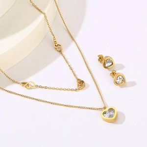Golden double-layer stainless steel heart necklace and stud earrings set with clear crystals