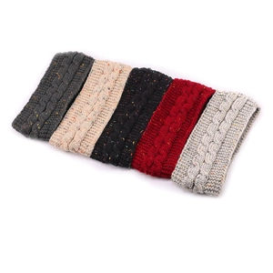 Detail view of winter knitted headbands in five colors with thick cable knit texture
