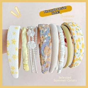 Detail of multi-style sponge headband set including floral patterns and beaded roses