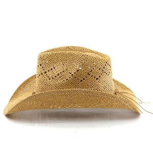 Detailed hollow weave pattern on a wide-brimmed paper straw cowboy hat in camel color
