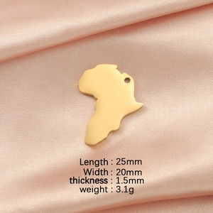Detailed view of gold Africa map pendant with measurements 25x20mm on pink satin