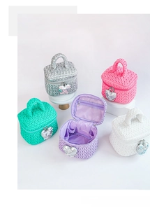 Quilted makeup bag with heart pendant and internal mesh pockets in five pastel colors