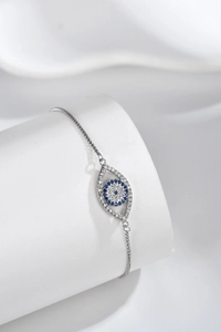 Close-up of S925 sterling silver evil eye bracelet with blue and white zircons