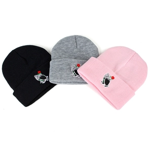 Embroidered knit beanies in black, grey, and pink featuring rose and hands design