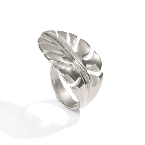 Polished silver monstera leaf ring detail highlighting tropical vein patterns on steel