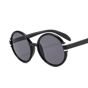 Vintage retro round black sunglasses with silver accents and polarized dark lenses