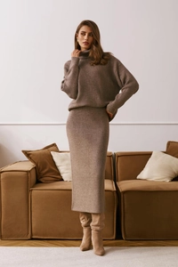 Detail of the high-neck knit sweater and straight midi skirt in tan color texture
