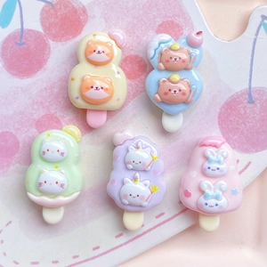 Macro shot of cute cartoon animal resin popsicle charms in vibrant assorted colors