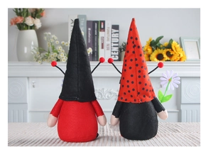 Detail of red and black ladybug plush dolls with felt texture for festive home decor