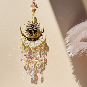 Detailed sun and moon metal suncatcher with clear crystal beads reflecting light