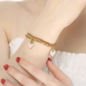 Double-layer gold stainless steel chain bracelet with pink strawberry enamel charms