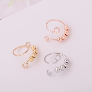 Three rotatable beads rings in gold, rose gold and silver finish with open design