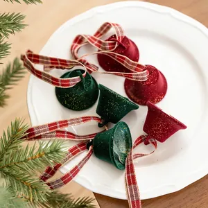 Set of 6 red and green flocked Christmas bells with ribbons for festive tree decoration