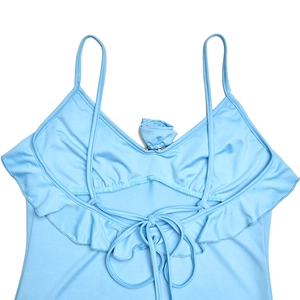 Detail of light blue camisole swimwear top with ruffle trim and lace-up back design