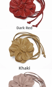 Detail of multi-strand PU leather waist belts featuring 3D layered flower designs in earthy tones