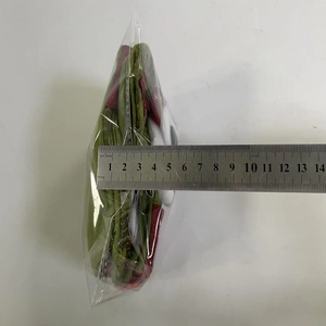 Measurement of small Christmas stocking charm showing 8cm width with a metal ruler
