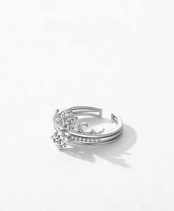 Macro view of crown-shaped S925 silver ring featuring full pavé diamonds and adjustable band