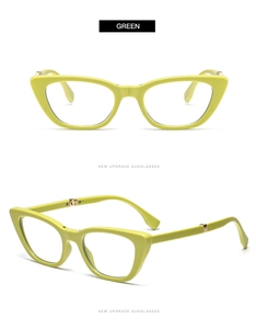 Detail view of foldable cat-eye glasses frames in neon green with metal hinge structure