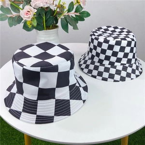 Macro detail of the high-quality black and white checkered fabric on a bucket hat