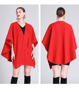 Front and back view of a red knit poncho cardigan with an open front and side pocket