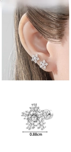 Detailed close-up of a snowflake cartilage stud with micro-set zircon and pearl center
