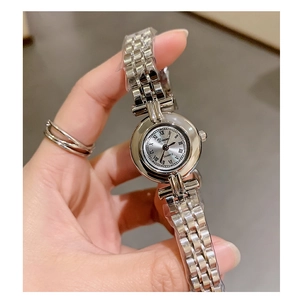 Close-up of elegant silver quartz watch with round dial and classic metal steel strap