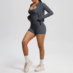 Deep grey three-piece yoga set featuring zip-up jacket, camisole, and high-waist shorts