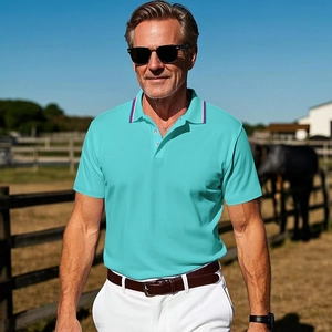 Detail of teal polo shirt featuring red, white, and blue striped collar on cotton fabric
