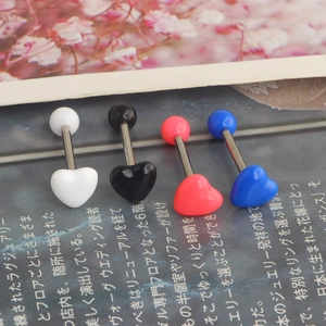 Macro shot of heart-shaped acrylic tongue rings in four colors with steel barbells