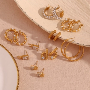 Detail shot of 18K gold plated stainless steel earrings with pearls and zircons