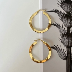Minimalist S925 sterling silver golden hoop earrings with textured wave design