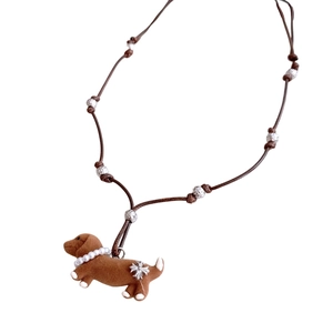 Handcrafted brown dachshund pendant necklace with pearls and woven leather cord