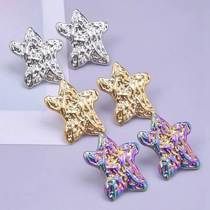 Detailed close-up of 304 stainless steel star earrings with irregular fluid metal texture