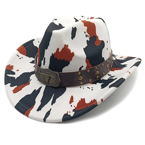 Close-up of cattle print cowboy hat with brown leather band and bull head metal buckle