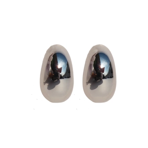 Polished silver teardrop earrings with a minimalist mirror finish on white background