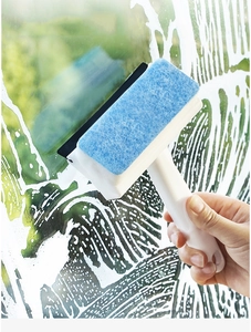 Close-up of dual-function window cleaner with blue sponge and rubber squeegee in use
