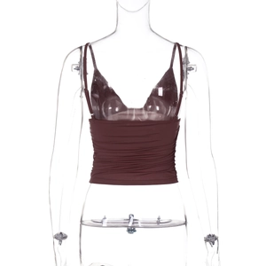 Detail of wine red V-neck camisole featuring delicate lace trim and pleated hem finish